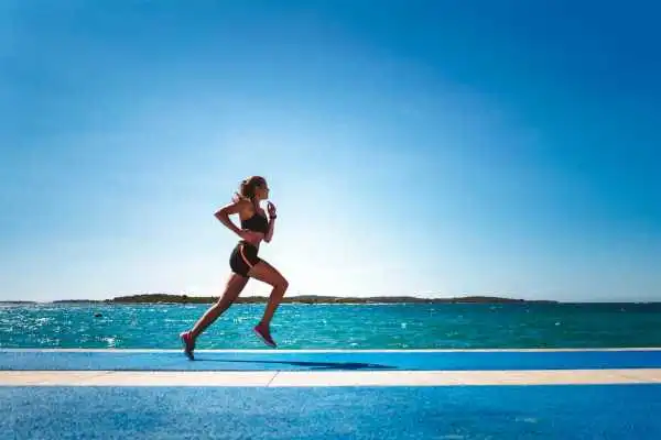 Woman running showing strong leg muscle Birchills